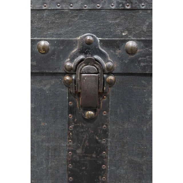 Sturdy shipping crate from the early 1900s Wooden structure covered in fabric, with iron corners and edges with metal...