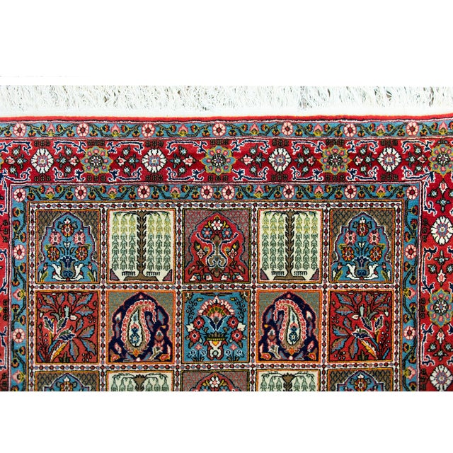 A wonderful vintage Persian Bakhtiari rug with an all-over patcherwork pattern with several repeated floral, paisley,...