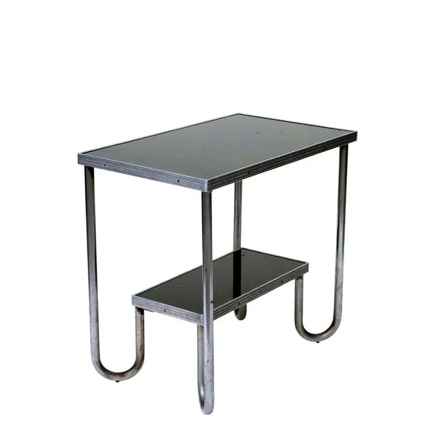 Rationalist coffee table Italy, 1920-1930 Metal tubular Tops in black laminate Very good condition No restorations...