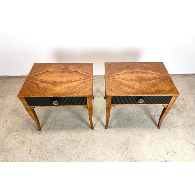 A beautiful and hard to find pair of Baker Furniture regency style side / end / bedside tables with ebonized and reeded...