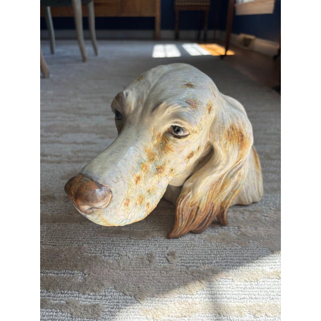 A large lifelike glazed porcelain head of an English Setter, the detail beautifully rendered, with sparkling eyes and a...