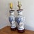 Pretty 1990s blue and white lamp pair with a floral bouquet motif. Wood base and cap. Please see condition details noted....