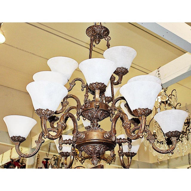 Here's a large gilt metal chandelier from a huge oceanfront spec. home in Florida with 15 candelabra-base bulbs, wired and...
