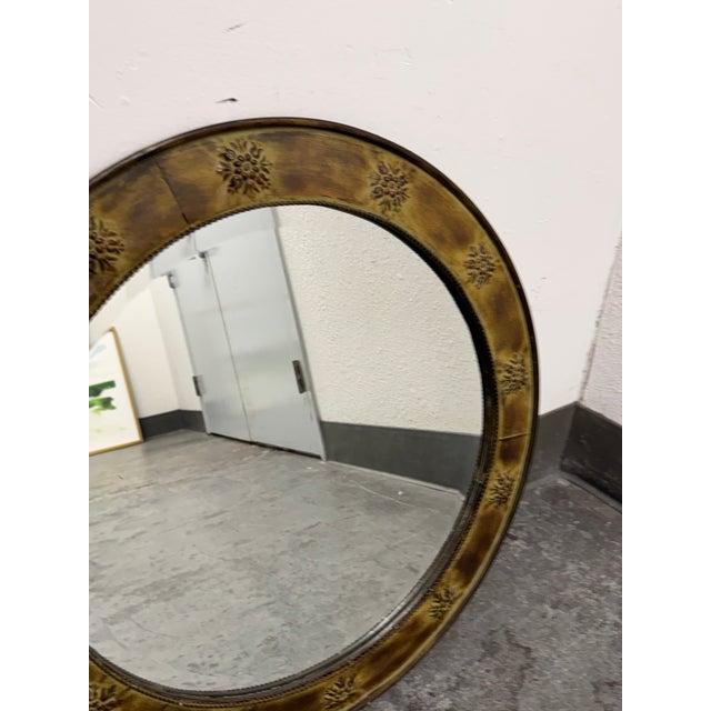 Design Plus Gallery presents a Vintage Round Gilt Metal Floral Medallion Wall Mirror. This circular mirror showcases an...