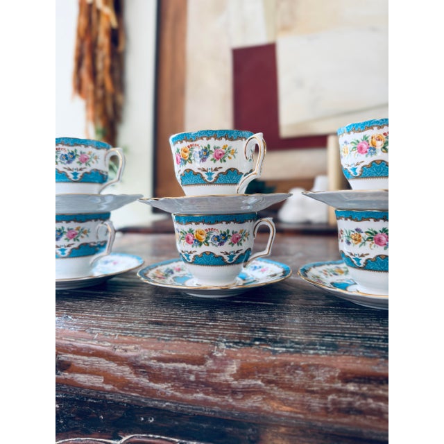 A beautiful 13-piece vintage Crown Staffordshire fine bone china tea set in the elegant Lyric Tunis Blue pattern, made in...