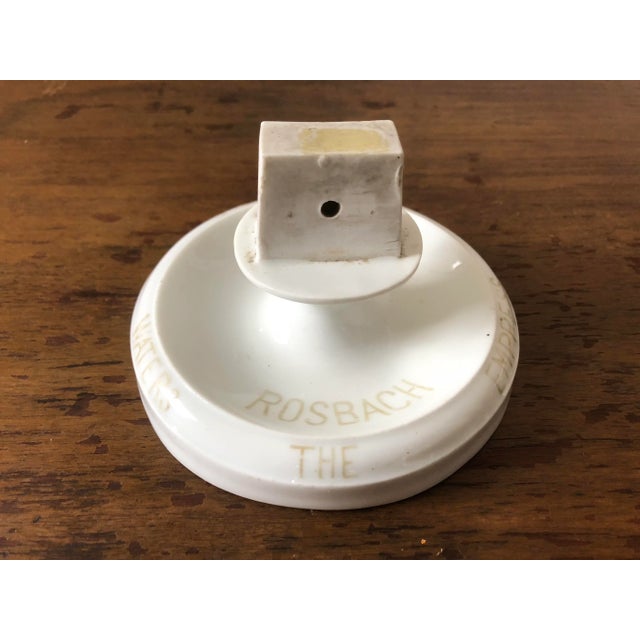 Early 20th century porcelain match striker/holder ashtray advertising Rosbach, "The Empress of Table Waters".