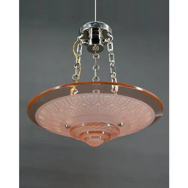 Modernist Art Deco chandelier/suspension, in acid-etched pink glass and chrome/nickel-plated bronze frame. Sign. By Henry...