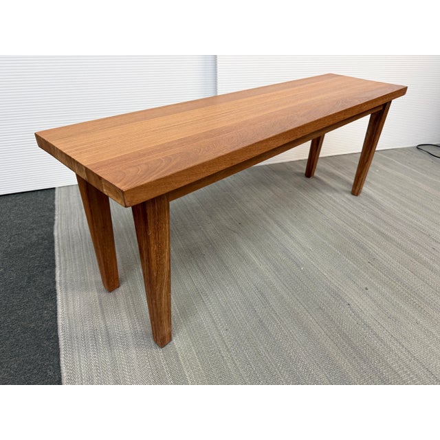 Design Plus Gallery presents a solid recycled teak bench purchased from Wooden Duck, featuring a warm natural patina,...