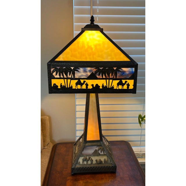 The Antique Meyda Arts & Craft Camel Mission Pyramid Egypt Slag Glass 3 Switch Lamp is a large, multicolor table lamp with...