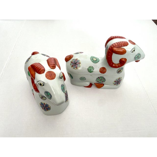 This is a rare pair of reproduction Staffordshire style Porcelain Asian Ram figurines that are also boxes. Hide valuables...