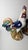 An impressive pair of large vintage ceramic rooster sculptures in the traditional European majolica style, featuring rich,...