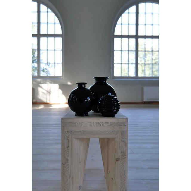 A set of 3 Art Deco Vases made in Sweden at Pukeberg. Solid black glass with that decorative art deco look. The two larger...