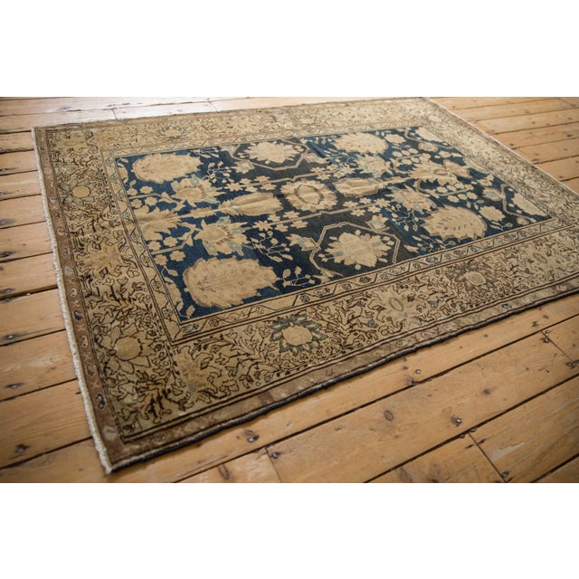 :: Asymmetric weighted rug with slightly offset center medallion and inwardly directed germinating blossoms. Nuanced...
