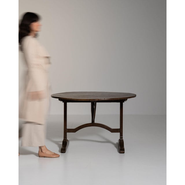 Round tilt-top drop-leaf table in Rich Walnut Brown. Its rich walnut brown finish sets off birdcage tilt mechanism, turned...