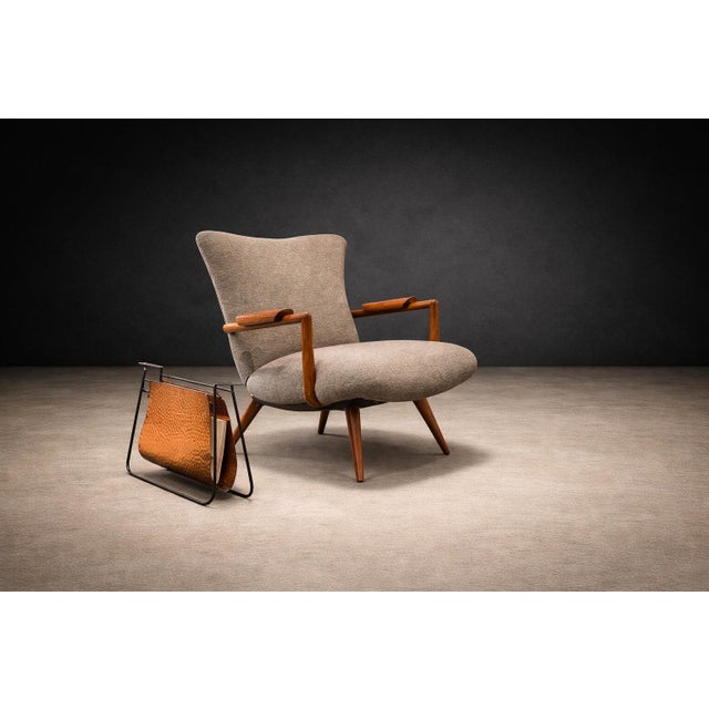 A sculptural exercise in material contrast, this magazine rack designed by Carlo Hauner and Martin Eisler for Forma in the...