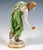 Extremely decorative, fully sculptural representation of an art nouveau beauty in a softly falling robe, tilted forward to...