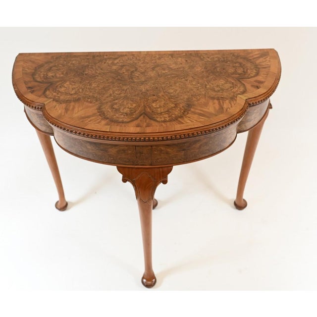 Elegant Queen Anne style card / games table. Hand crafted from burr walnut and circa 1930. Dimensions in inches (CM):...