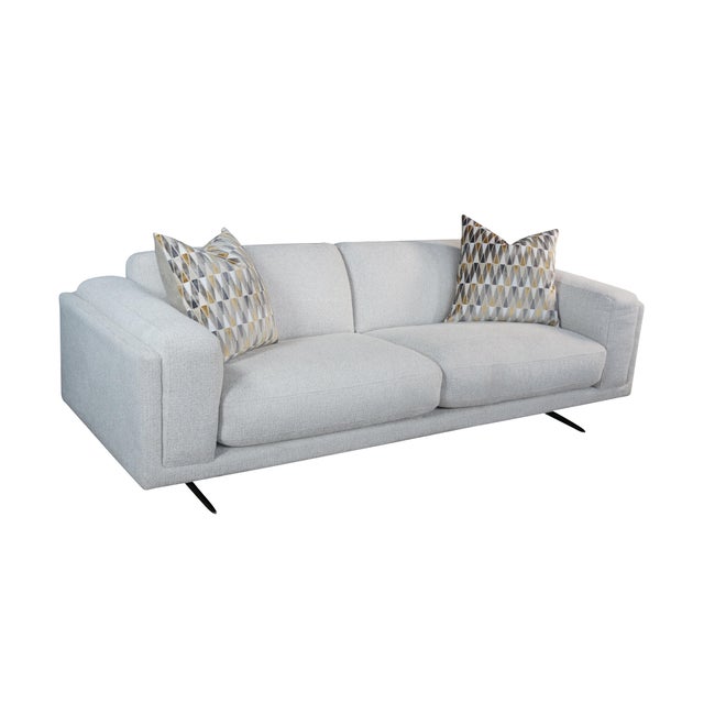 The Nabu Sofa in Sand Fabric brings a clean, contemporary aesthetic and welcoming comfort to any modern living space....