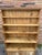 This cabinet is a classic antique pine dresser hutch, a traditional piece of farmhouse furniture often used in kitchens or...