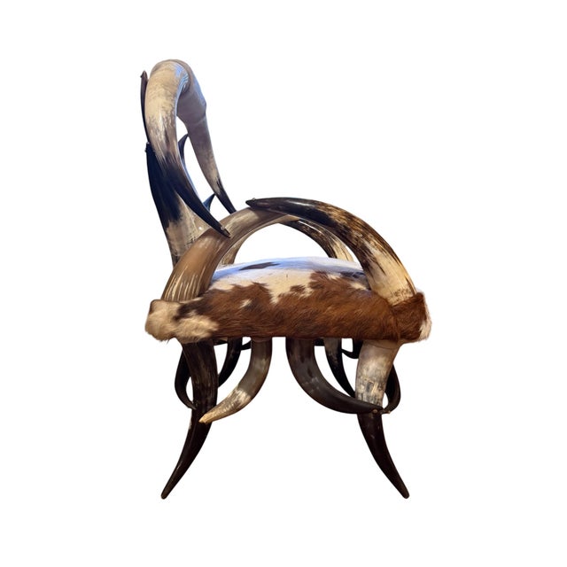 This striking longhorn cowhide chair is a one-of-a-kind statement piece that blends rustic Western charm with sculptural...