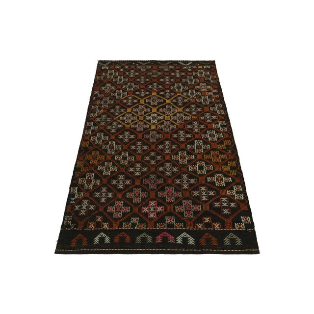 A vintage Kilim rug in 5x9, from a prominent curation of the Cecim tribal rug family in our acclaimed collection....
