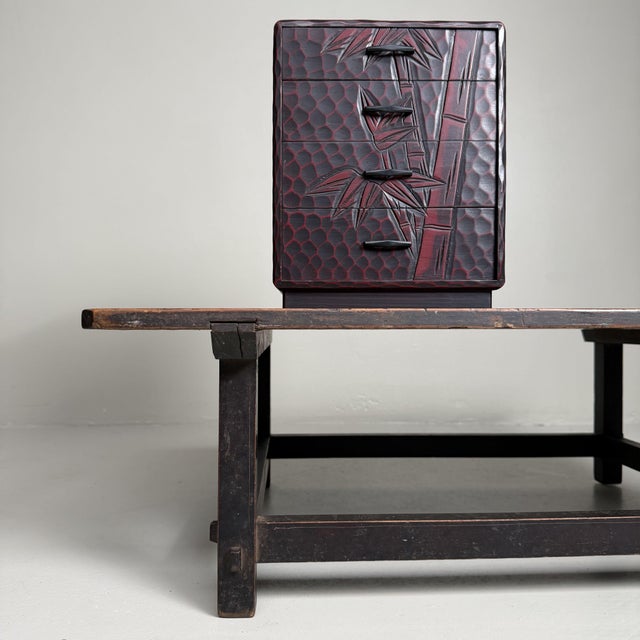 This small Kamakura-bori haribako is a characterful Japanese storage chest made of hand-carved and lacquered wood....