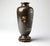 A finely decorated Japanese Meiji period bronze vase of ovoid form, presented on its original fitted carved hardwood...