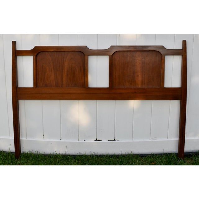 Vintage (1960's) Headboard has an Mid Century Modern Style. Made of Wood. Walnut. The Measurements: 54.5"W x 2.5"D x 39"H.