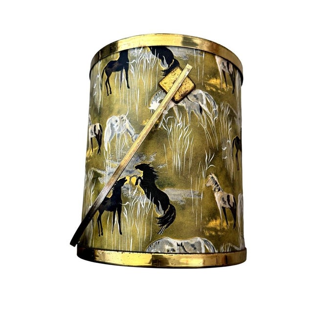 This rare vintage mid-century modern ice bucket features a striking equestrian design with gold and brass accents for a...