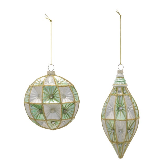 Elevate your holiday decorating with this set of 6 Glass Ornaments, featuring two charming sizes for added dimension on...