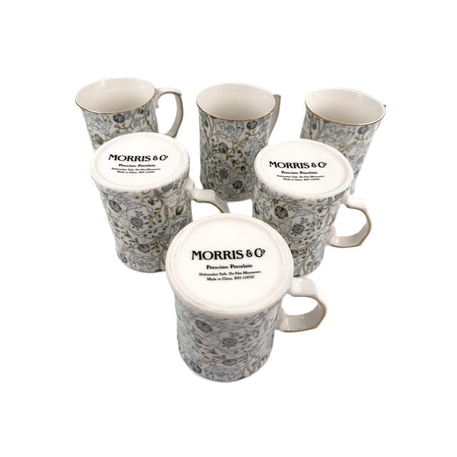 Elevate your daily ritual with this elegant set of six porcelain mugs inspired by the timeless design of Morris & Co.,...
