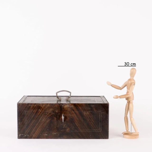 Small box in imitation wood enamelled iron and decorated with silver-colored geometric profiles. Inside identification...