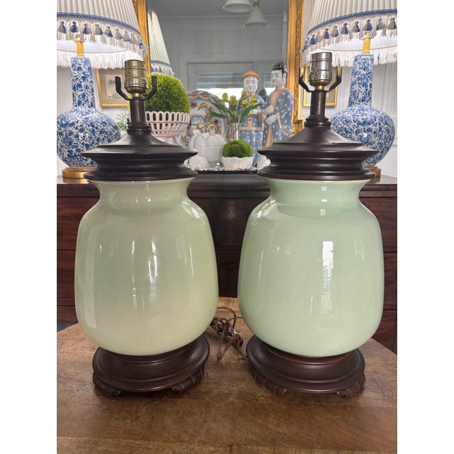 Beautiful pair of soft green ginger lamps by Haegar. Lovely shade of green, similar to celadon, with dark brown fittings...