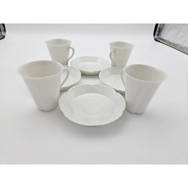 Dainty demitasse cups w/ saucers coordinate with separately listed hot chocolate/tea set. Demitasse cups are much smaller...