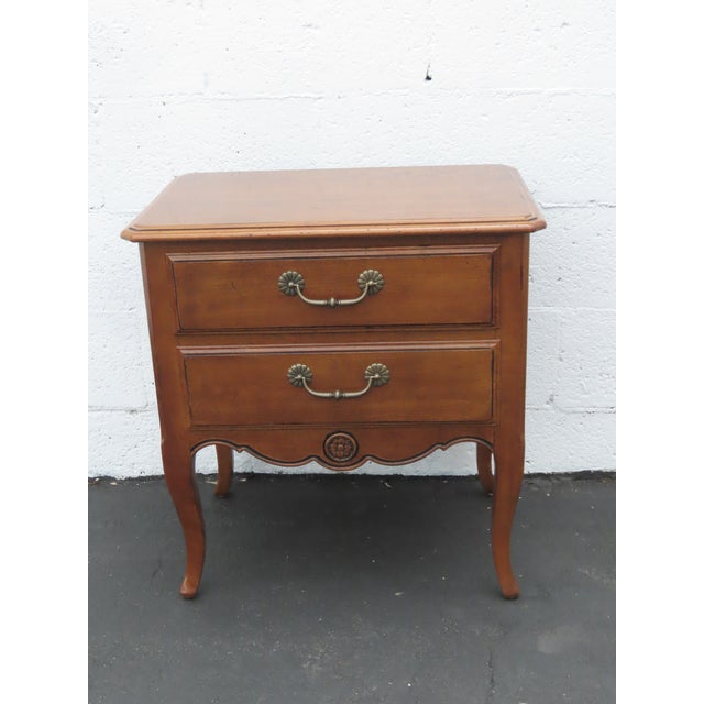 This Nightstand / End / Side Table is made out of wood and solid wood. It has a French style and design, with distressed...