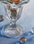 A charming little realist painting of marbles in a sundae glass. Turned up in our inventory, new and never owned. Custom...