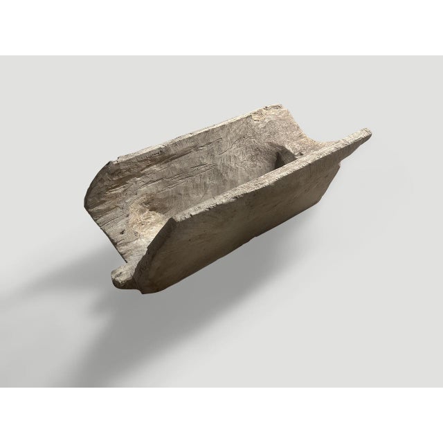 Beautiful antique rice holder from Sumatra, hand carved from a single piece of wood. Perfect for holding firewood, towels...