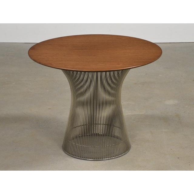 A mid century modern round walnut top end table designed by Warren Platner for Knoll. Professionally refinished. Circa...