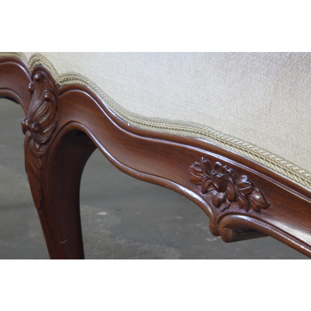 This hand-carved and decorated wooden sofa from the mid-18th century embodies timeless French elegance. A classic French...