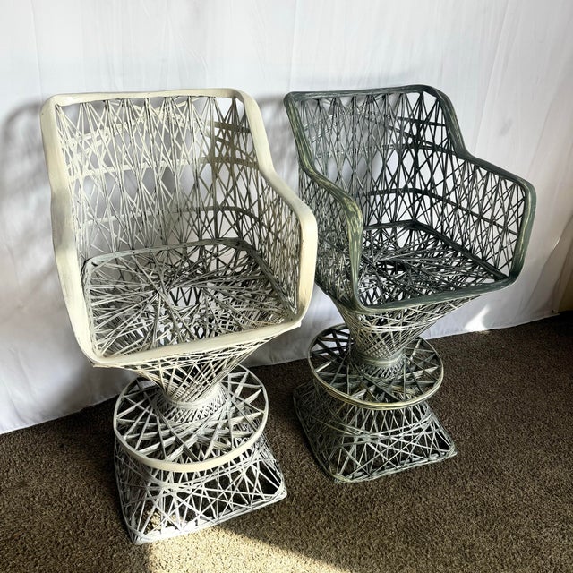 Introducing a Mid-Century Modern Spun Fiberglass pair of stools, featuring two matching stools. Each piece showcases...