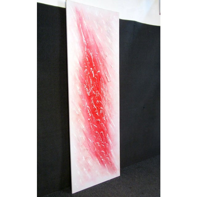 This large raised textured impasto painting features an abstract theme perfect for any room in need of a splash of color....