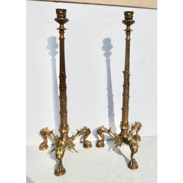 French Empire or Neoclassical style candlesticks. zFinely formed with panther heads and reeded stems. Palmettes rise, with...