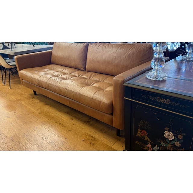 Elegant and updated Poly & Bark brown leather Napa leather three seater sofa. Stylish and comfortable and just the right...