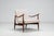 A beautifully sculptural Danish lounge chair from the 1960s, featuring a refined teak frame and distinctive organic lines....