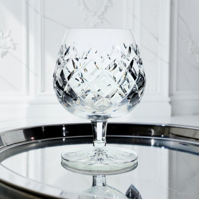 This authentic Waterford Crystal Powerscourt brandy glass was produced in Ireland during the Late 20th Century, circa...