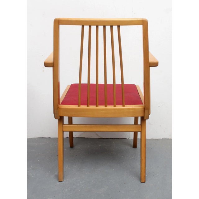 50s armchair, ideal for a desk. Solid beech in bright, seat retapizados red artificial leather. Minor wear on the wood.