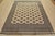 A tribal Bokhara Jaldar rug hand-knotted with fine wool on a cotton foundation. This rug features rows of repeating...