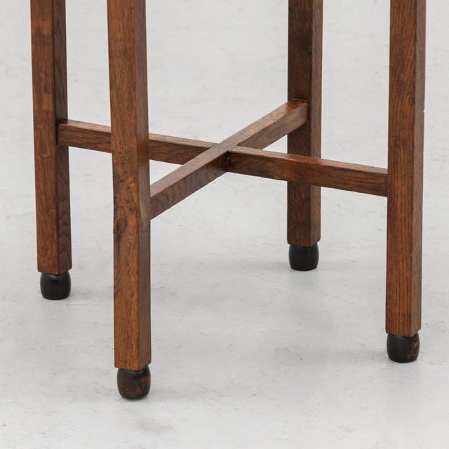 Charming Art Deco side table dating from circa 1920–1930, made of dark-stained oak and closely related to the Dutch...