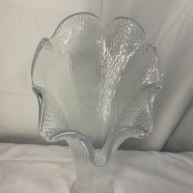 This item appears to be a vintage clear pressed or stretch glass vase featuring a flared, ruffled "jack-in-the-pulpit" or...