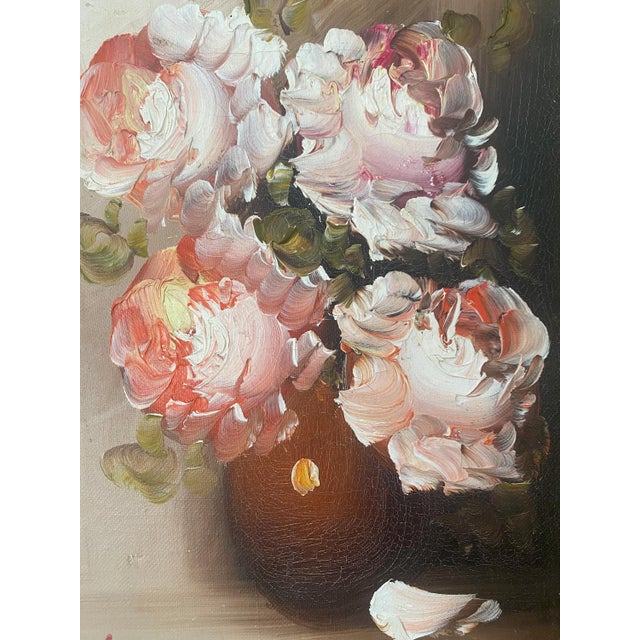 A romantic little still life that feels lifted straight from a European sitting room. This vintage floral oil painting by...